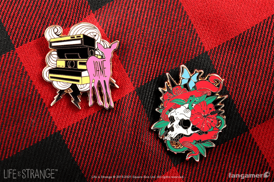 Two enamel pins. Left: a "Jane doe" pin with polaroid camera, swirls, and lightning bolts. Right: A skull surrounded with thorns, ribbons, hibiscus flowers, and a blue butterfly.
