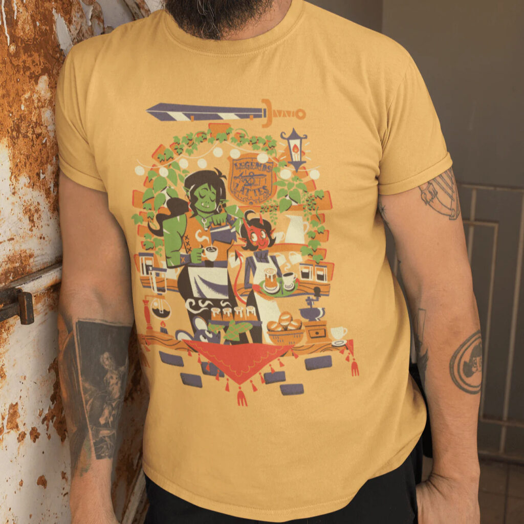 Photo of a man with tattoos wearing the Legends & Lattes shirt.