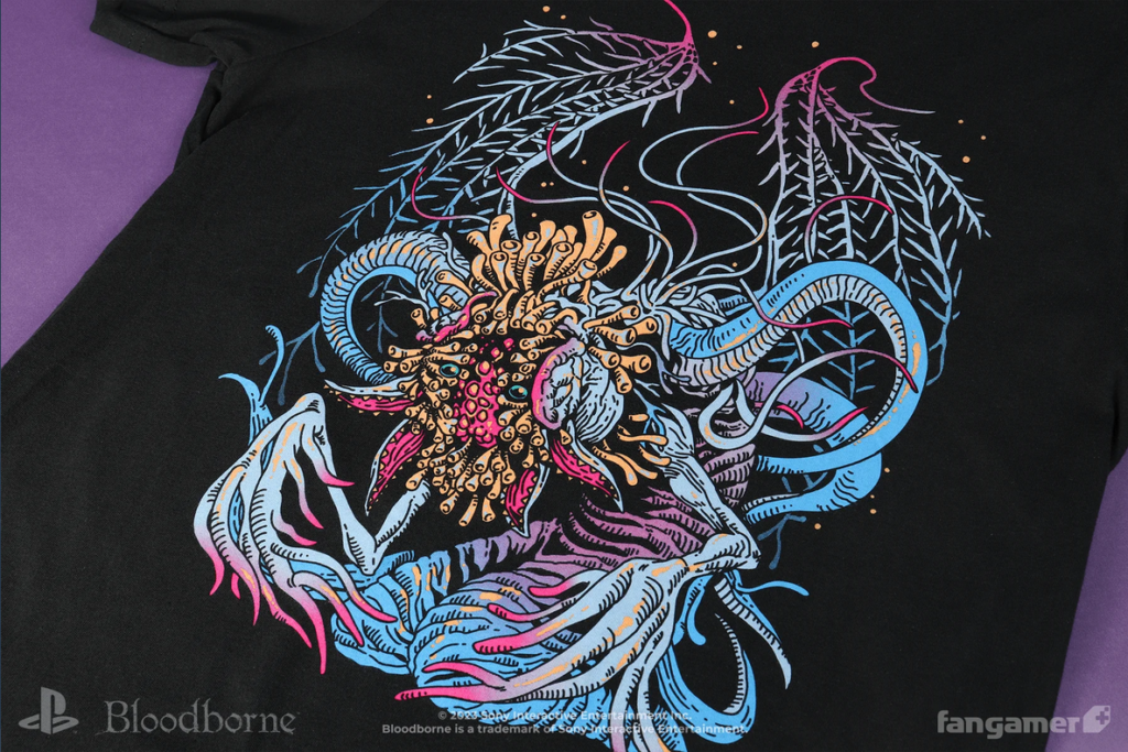Shirt depicting Ebrietas from Bloodborne, a monstrous creature that resembles a slug with squid-like tentacles emerging from her back. Her face appears split in half and is covered in strange growths that resemble fungus that surround her vulnerable head. She possesses a set of skeletal wings.