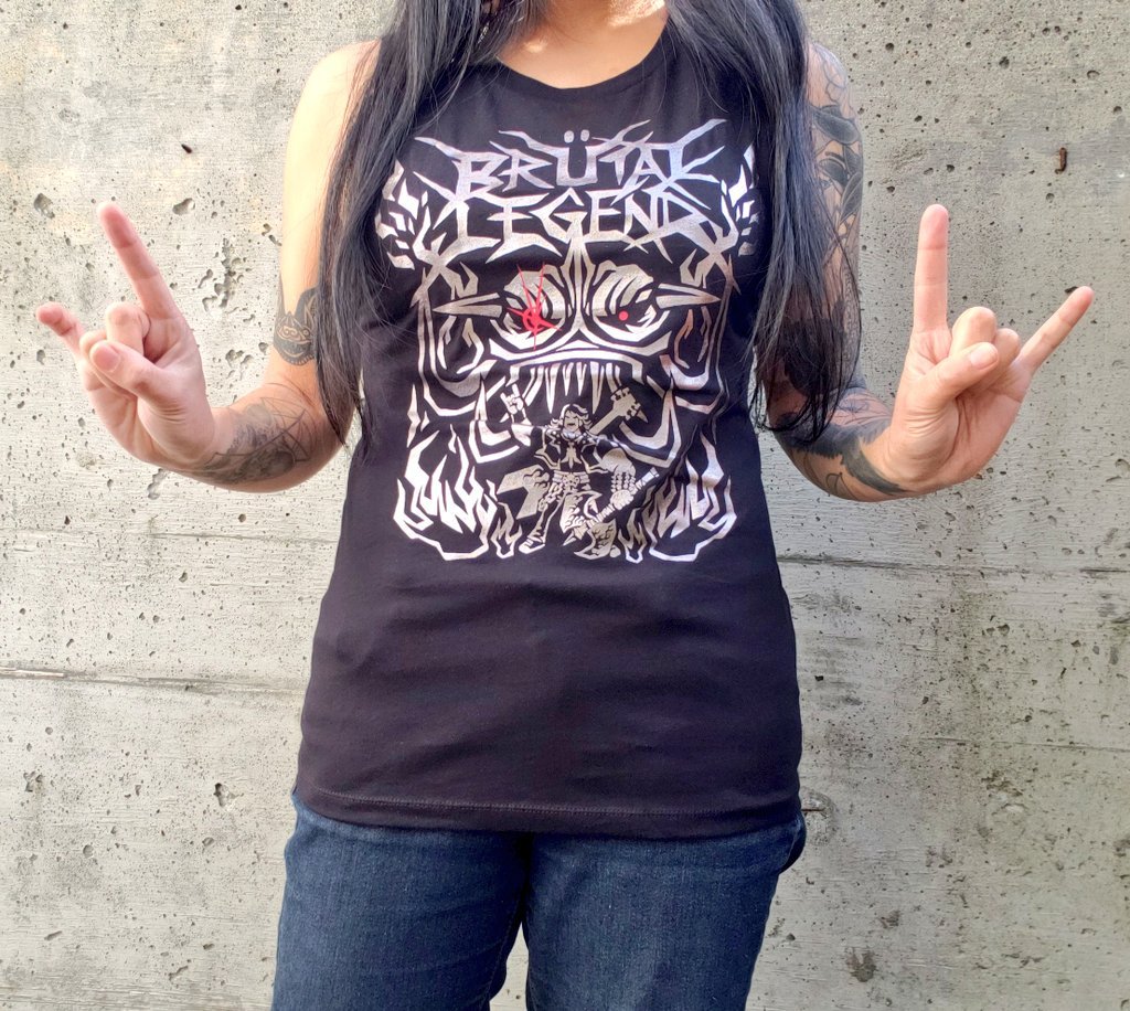 Photo of me wearing the Brütal Legend tank top, doing the devil horn gesture with my hands