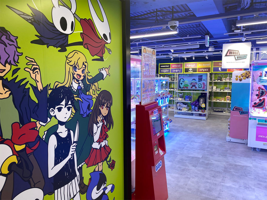 Photo of the Fangamer Japan shop in Shibuya, with a bit of the mural showing on the left