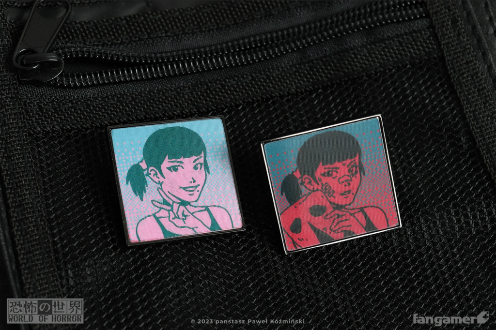 The "Doomed Already" lenticular pin pinned to a bag, showing both viewing angles.